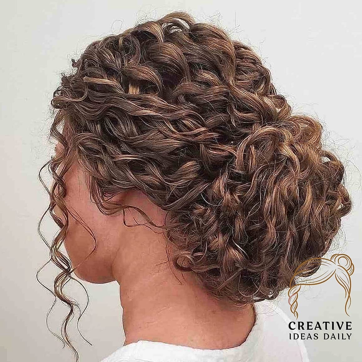 21 Updos For Long Hair Ideas That Are Trending Right Now 14 Curly Updo With Loose Tendrils
