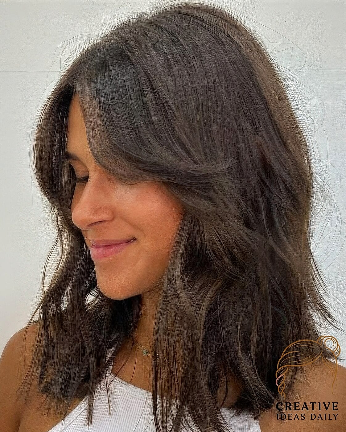 Curtain Bangs With Face-Framing Layers