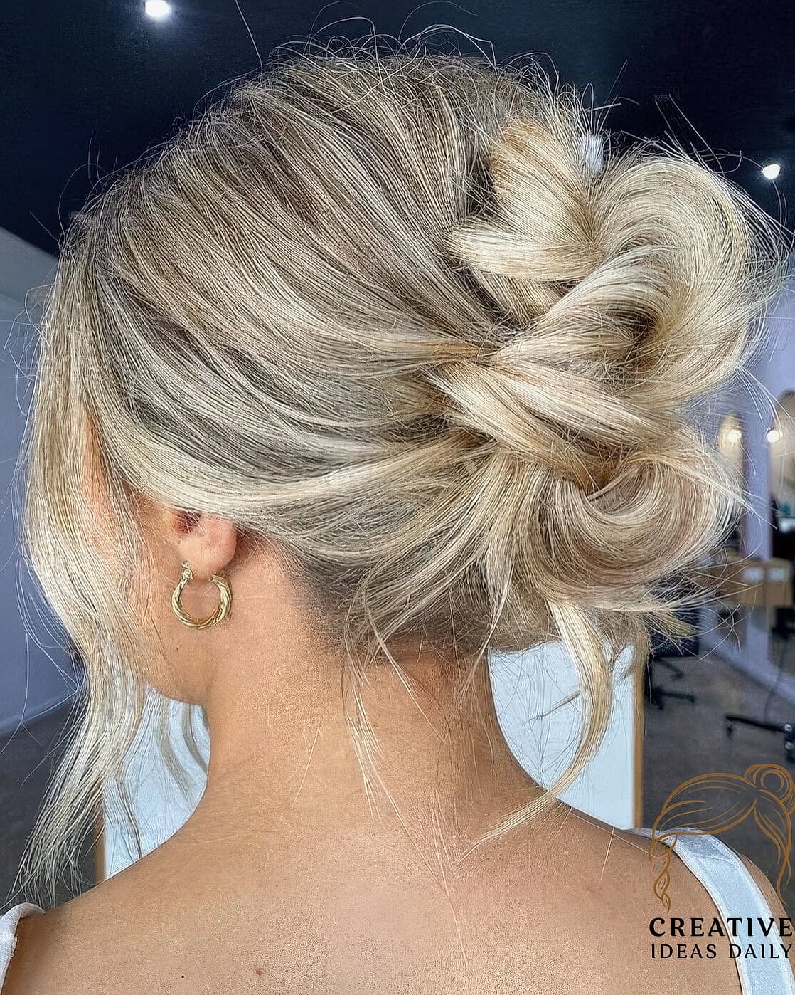 Loose Updo With Face-Framing Waves