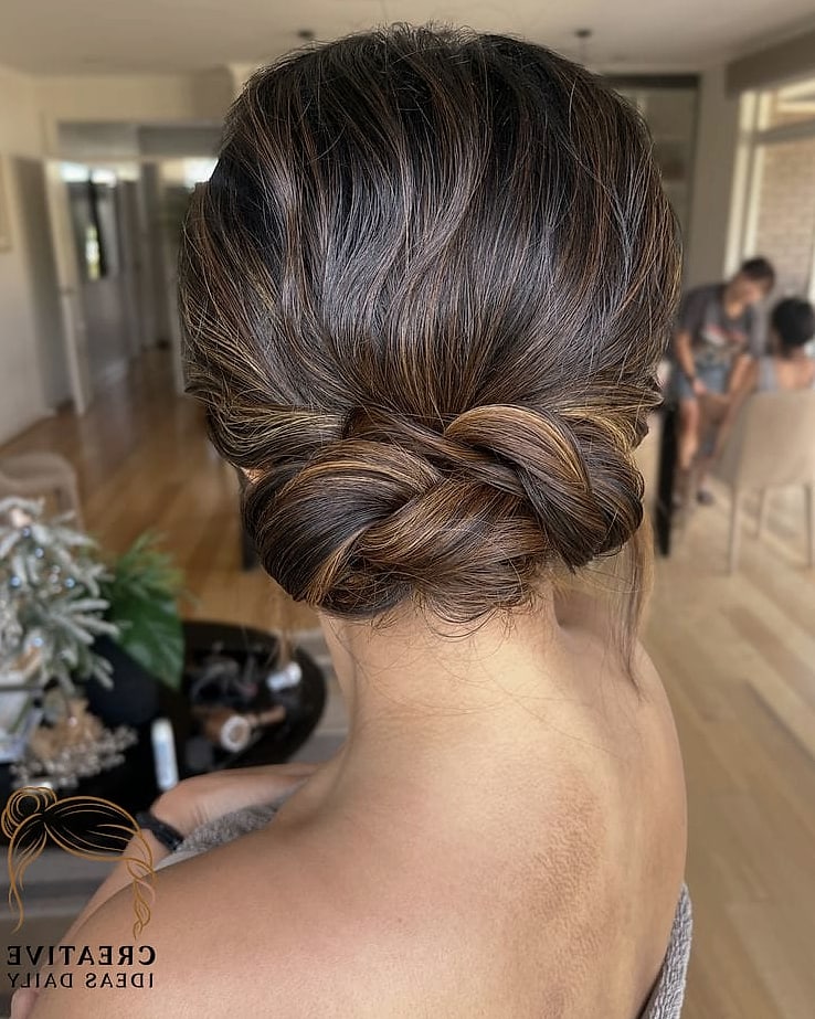Low Twisted Bun with Face-Framing Pieces