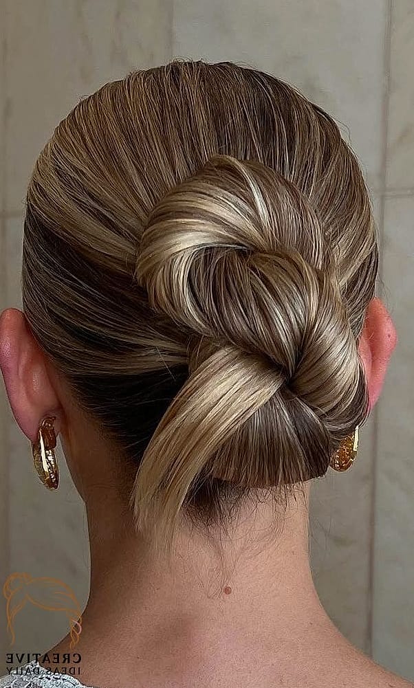21 Updos For Long Hair Ideas That Are Trending Right Now 1 Low Twisted Bun
