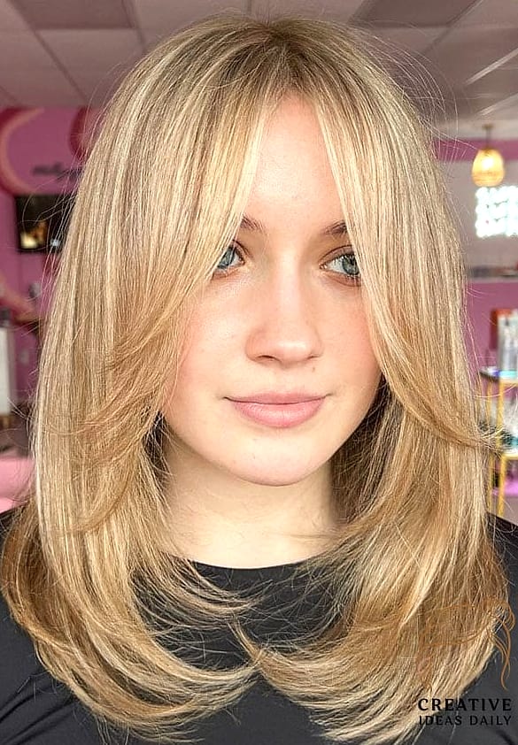 Medium Layers with Curtain Bangs Chic 90s Feel