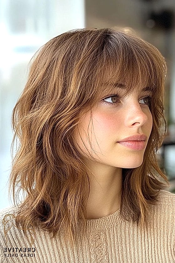 27 Medium Length Hair Ideas Every Woman Needs to See 1 Textured Lob With Curtain Bangs