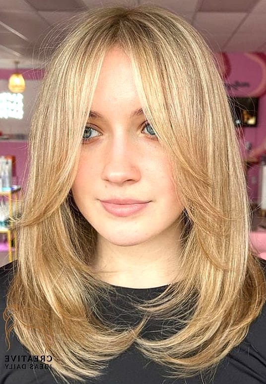 Voluminous Layers with Curtain Bangs